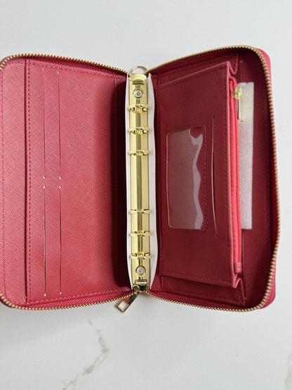 Open red wallet with gold zipper on a white background